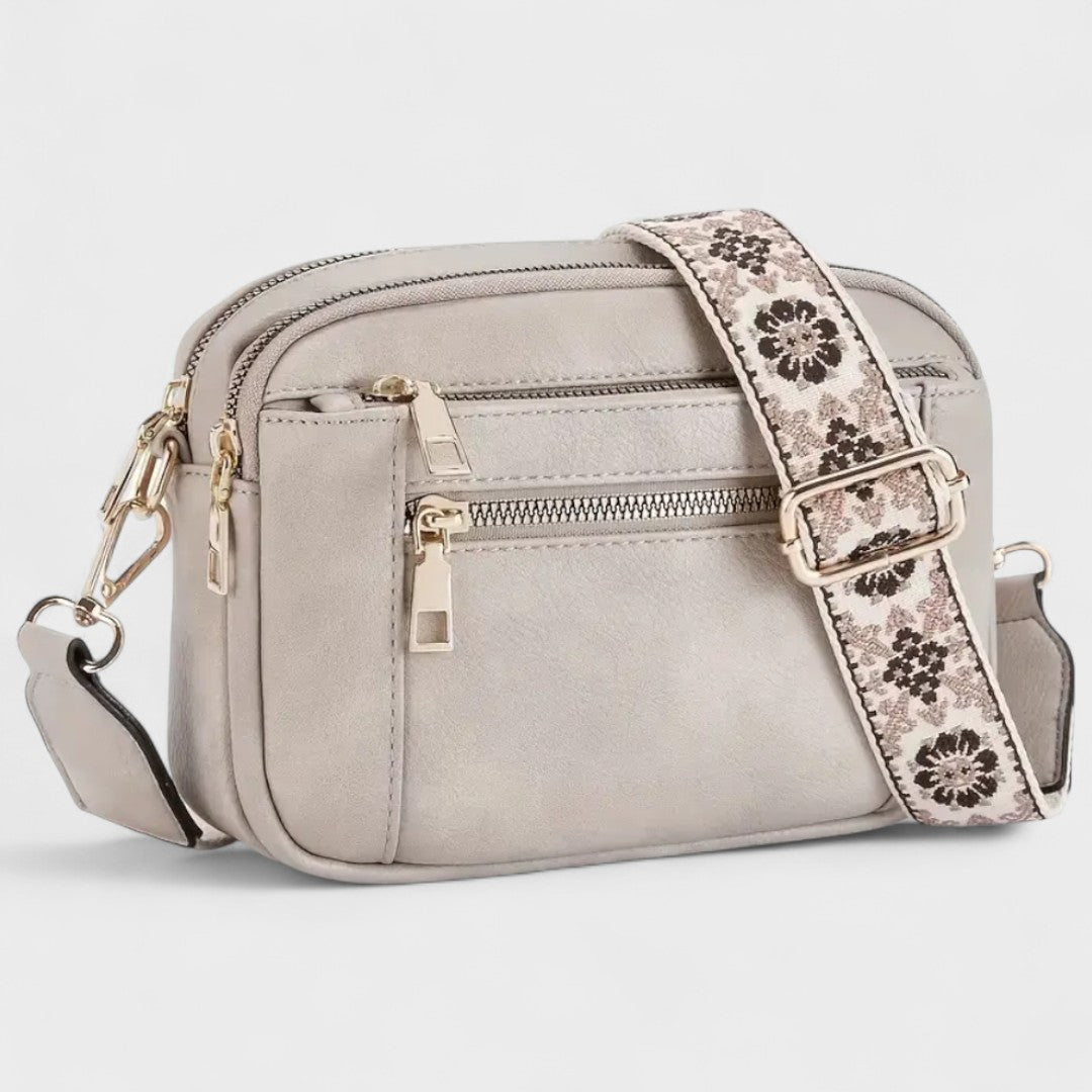 Olivia - Bolso bandolera con correa estampada