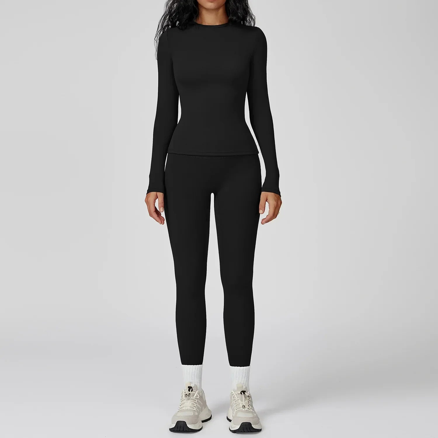 Traje deportivo con leggings y manga larga