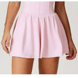 Vestido deportivo con cremallera y pantalones escondidos